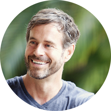 A smiling woman with short brown hair